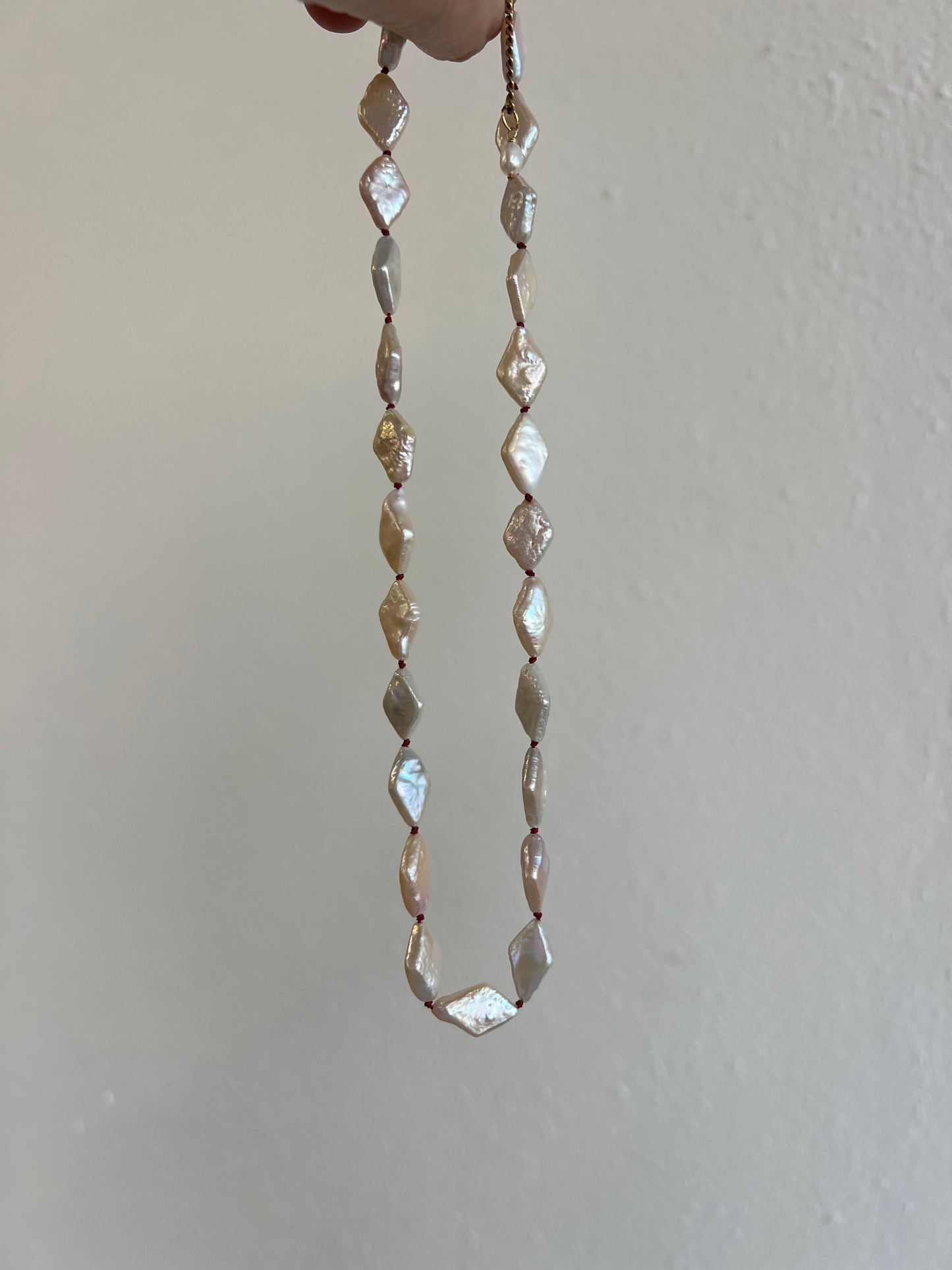 The Knot in Diamond Shape Pearls