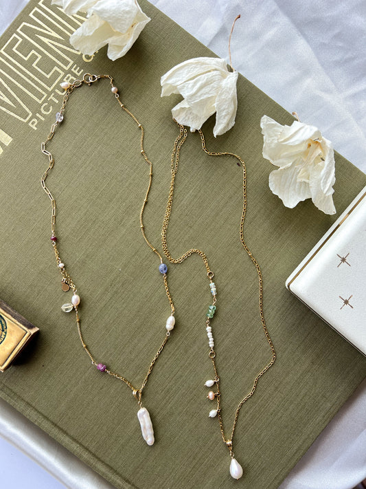 Left chain featuring a long stick pearl. Right chain featuring a teardrop pearl.