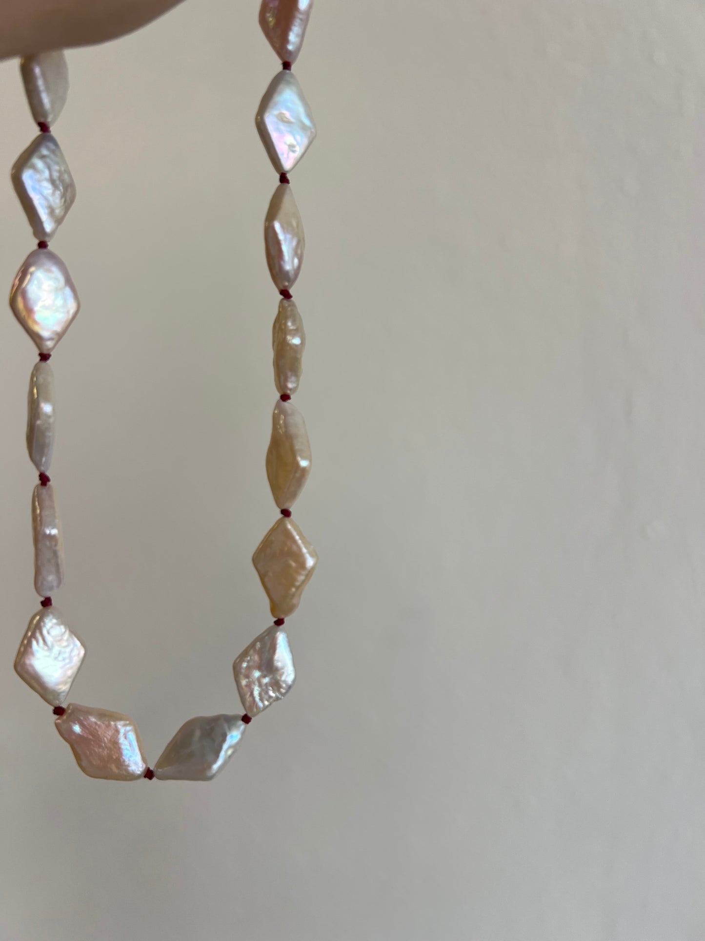 The Knot in Diamond Shape Pearls